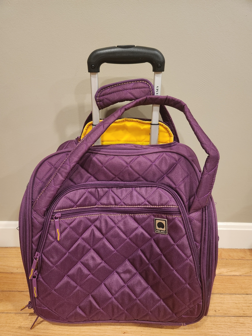 NWOT Delsey Quilted Rolling Carry-on